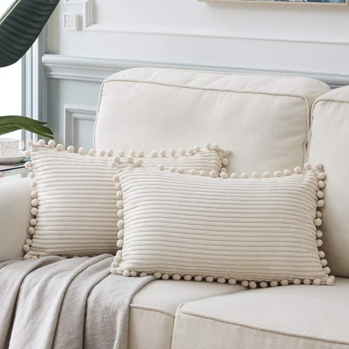 Fancy Homi Pack of 2 Boho Rectangle Decorative Throw Pillow Covers with Pom-poms, Soft Corduroy Accent Solid Cushion Case Set for Couch Sofa Bedroom Car Living Room (14x24 Inch/35x60 cm, Cream)