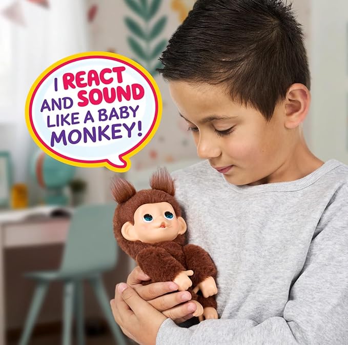Little Live Pets Baby Monkey Minis – Chikki Cherry. Interactive Pet Toy. 20+ Sounds & Reactions. Soft Brown Fur. 7.4" Tall. Super Realistic. Feed, Nurture, React. Grippy Hands & Feet. Collect All 3