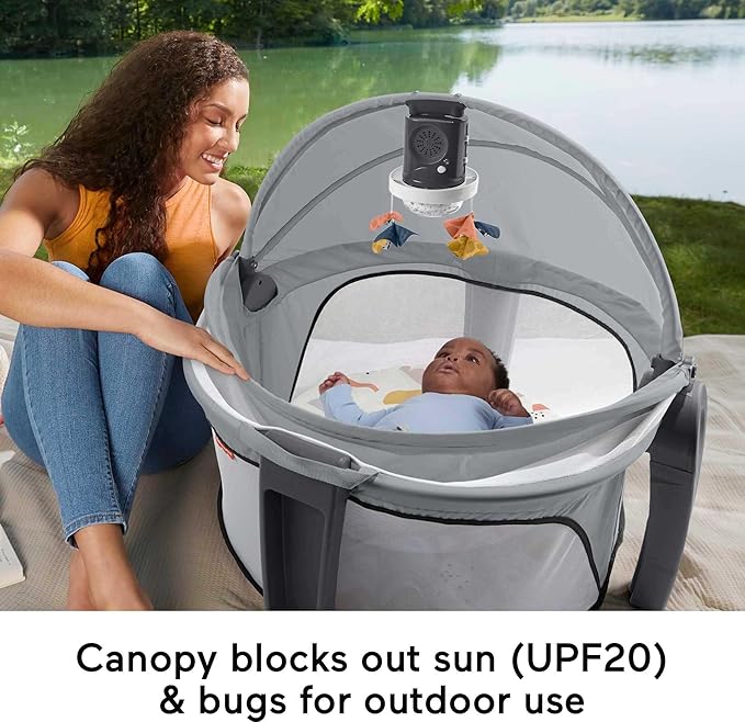 Fisher-Price Portable Baby Bassinet and Play Space Deluxe On-the-Go Projection Dome with Lights Music and Canopy, Paper Shapes