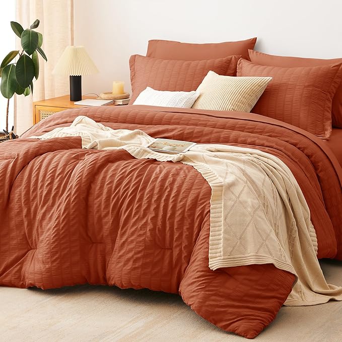 CozyLux Oversized King Comforter Set Burnt Orange Seersucker 7 Pieces 120x98 Bed in a Bag Comforter Set with Sheets, Terracotta Bedding Set with Down Alternative Comforter, Sheets, Pillowcases & Shams