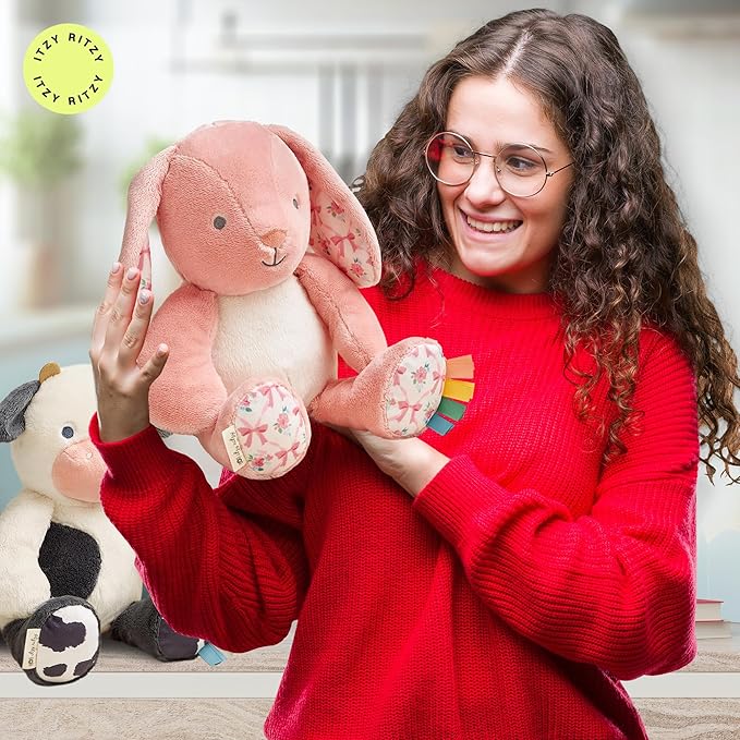 Itzy Ritzy Snuggles Plush Toy – Soft Stuffed Animal for Babies, Kids & Adults – Sensory Ribbons & Textured Fabrics for Tactile Play – Cozy & Cuddly Companion for Newborns & Up (Pink Bunny)