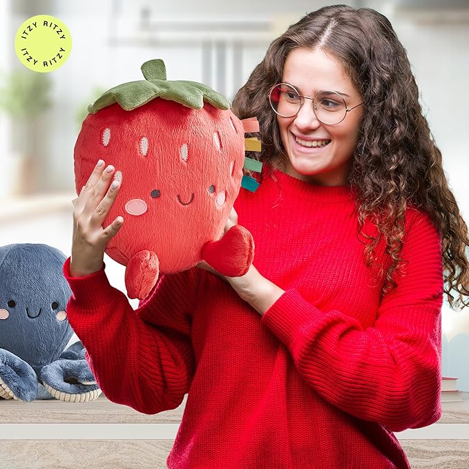 Itzy Ritzy Snuggles Plush Toy – Soft Stuffed Animal for Babies, Kids & Adults – Sensory Ribbons & Textured Fabrics for Tactile Play – Cozy & Cuddly Companion for Newborns & Up (Strawberry)